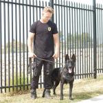 Mason onsite with K9 security dog